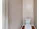 Minimalist bathroom featuring a modern toilet and neutral wall color, and wood flooring at 112 Salmon River Dr, Durham, NC 27705