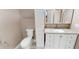 Bathroom featuring a toilet, a vanity with sink and storage, and a cabinet at 112 Salmon River Dr, Durham, NC 27705