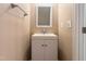 Clean and simple bathroom featuring a white vanity, a square mirror, and neutral wall color at 112 Salmon River Dr, Durham, NC 27705