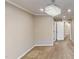 A well lit bedroom with a decorative ceiling light, fresh paint, and large closet space at 112 Salmon River Dr, Durham, NC 27705