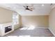 Bedroom featuring neutral paint, a fireplace, carpet and abundant light at 112 Salmon River Dr, Durham, NC 27705