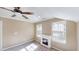 Bedroom featuring neutral paint, a fireplace, carpet and abundant light at 112 Salmon River Dr, Durham, NC 27705
