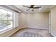 A bright bedroom with a ceiling fan, natural light, fresh paint, and updated flooring at 112 Salmon River Dr, Durham, NC 27705