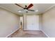 A well lit bedroom with a ceiling fan, fresh paint, and large closet space at 112 Salmon River Dr, Durham, NC 27705