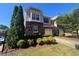 Attractive two-story townhome with stone accents, attached garage, and meticulously landscaped front yard at 112 Salmon River Dr, Durham, NC 27705