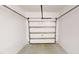 Clean garage interior with a sectional door, presenting a secure parking and storage solution at 112 Salmon River Dr, Durham, NC 27705