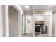 Hallway with laundry appliances and bathroom featuring neutral paint throughout at 112 Salmon River Dr, Durham, NC 27705