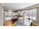 Modern kitchen featuring white cabinetry, stainless appliances, island and hardwood flooring at 112 Salmon River Dr, Durham, NC 27705