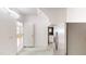Bright kitchen area featuring stainless steel appliances, white cabinets, and an adjacent living space at 112 Salmon River Dr, Durham, NC 27705
