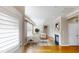 Inviting living room is virtually staged, with a fireplace, built-in shelving, and large windows at 112 Salmon River Dr, Durham, NC 27705