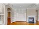 Living room with hardwood floors, built-in shelving, recessed lighting, and natural light at 112 Salmon River Dr, Durham, NC 27705