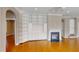 Living room featuring hardwood floors, built-in shelving, recessed lighting, and a fireplace at 112 Salmon River Dr, Durham, NC 27705