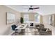 Bright office area with large windows, ceiling fan, fireplace and stylish decor at 112 Salmon River Dr, Durham, NC 27705