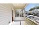 Relaxing outdoor patio space with natural light, view of the street, and white accents for tranquil living at 112 Salmon River Dr, Durham, NC 27705
