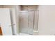 Walk-in shower with glass doors and shower head at 112 Salmon River Dr, Durham, NC 27705