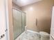 Walk-in shower featuring glass door and tiled walls at 112 Salmon River Dr, Durham, NC 27705