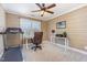Bedroom with a treadmill, an office space, a ceiling fan and natural light at 114 Boone Trl, Garner, NC 27529