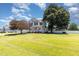 Charming two-story home featuring a lush green lawn and a welcoming front porch at 114 Boone Trl, Garner, NC 27529