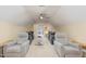 Finished room with projector and screen and comfy seating creates a great home theater experience at 114 Boone Trl, Garner, NC 27529