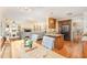 Open concept kitchen featuring a kitchen island, wood cabinets, granite countertops, stainless steel appliances, and an eat-in kitchen at 114 Boone Trl, Garner, NC 27529
