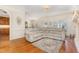 Comfortable living room area with hardwood floors and a relaxing sectional sofa at 114 Boone Trl, Garner, NC 27529