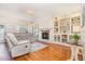 Cozy living room with built-in bookshelves, a fireplace, and a comfortable sofa at 114 Boone Trl, Garner, NC 27529