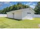 Large outbuilding with garage door and single door, offers extra storage and convenience at 114 Boone Trl, Garner, NC 27529