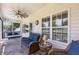 Cozy screened-in porch with comfortable seating and ceiling fan at 114 Boone Trl, Garner, NC 27529