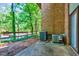 This patio features easy access to the backyard, and the home's exterior brick adds a traditional touch at 1221 Teakwood Pl, Raleigh, NC 27606