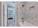 Modern bathroom featuring white subway tile in shower/tub combo and a view to the bedroom beyond at 1221 Teakwood Pl, Raleigh, NC 27606