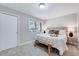 This bedroom features a cozy bed, a large window and bedside lamps, creating a comfortable and inviting atmosphere at 1221 Teakwood Pl, Raleigh, NC 27606