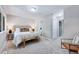 Bright bedroom features large windows, a neutral color palette, and an adjacent bathroom and closet at 1221 Teakwood Pl, Raleigh, NC 27606