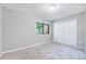 Bright bedroom boasts plush carpeting, a window with a view and ample closet space at 1221 Teakwood Pl, Raleigh, NC 27606