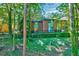 This exterior view showcases the property's well-maintained landscaping and its charming brick facade at 1221 Teakwood Pl, Raleigh, NC 27606