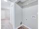 Functional laundry room includes washer and dryer hookups, with easy access to the adjacent hallway and bedroom at 1221 Teakwood Pl, Raleigh, NC 27606
