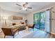 Bright living room featuring a neutral palette, modern furnishings, and sliding glass doors to the outside at 1221 Teakwood Pl, Raleigh, NC 27606
