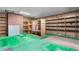 Spacious basement area with shelving, paneled walls, and fluorescent lighting at 1315 Elder Way, Burlington, NC 27215