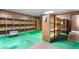 Spacious basement area featuring paneled walls and built in shelving at 1315 Elder Way, Burlington, NC 27215