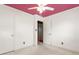 Neat white walled bedroom with an open closet and pink ceiling at 1315 Elder Way, Burlington, NC 27215