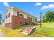 Charming single-story home with brick details, awning-covered windows and a manicured lawn at 1315 Elder Way, Burlington, NC 27215