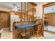 Charming kitchen with a cozy breakfast bar, wood cabinetry, and access to other rooms at 1315 Elder Way, Burlington, NC 27215
