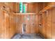 Utility storage room with wood paneling and mounted shelves at 1315 Elder Way, Burlington, NC 27215