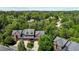Aerial view of a neighborhood showcasing well-maintained homes and lush, green trees at 145 Cofield Cir, Durham, NC 27707