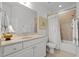 Well-lit bathroom showcasing a vanity with sink, mirror, toilet, and shower-tub combination at 145 Cofield Cir, Durham, NC 27707