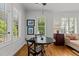 Cozy breakfast nook with windows, providing natural light and a view of the outdoors at 145 Cofield Cir, Durham, NC 27707