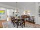 Traditional dining room with wooden table, chandelier, and ample space for entertaining at 145 Cofield Cir, Durham, NC 27707