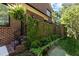 Brick exterior showcasing beautiful greenery, shrubs, and a well-manicured landscape at 145 Cofield Cir, Durham, NC 27707