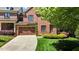 Beautiful brick home with a two-car garage, lush landscaping, and a well-manicured lawn at 145 Cofield Cir, Durham, NC 27707