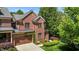 Brick house showing roof, yard and shrubbery on a sunny day at 145 Cofield Cir, Durham, NC 27707