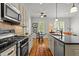 Modern kitchen with stainless steel appliances, tile backsplash, and breakfast nook at 145 Cofield Cir, Durham, NC 27707